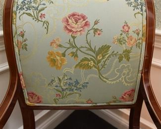 ITEM 2: Kindel Neoclassical Upholstered Dining Chairs (10)  $1500:
Upholstered in luscious pale blue fabric with yellow, pink and blue flowers, and double piping. Woodwork and upholstery are in excellent condition. Eight side chairs, two armchairs. 