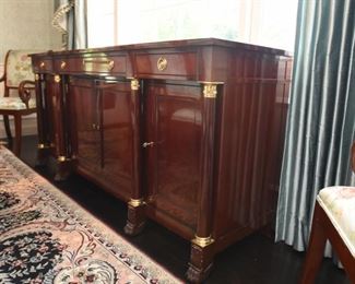 ITEM 3: Kindel Neoclassical Sideboard  $425:
Matches dining table, breakfront and chairs. Center drawer locks and has silver storage. This piece has sun fading on the top back edge nearest the window. Otherwise in very good condition. 76" long x 21" deep, x 34.5" tall