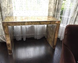 ITEM 16: Mirrored Sofa Table  $325
Mirror finished with swaths of gold, copper, bronze tones. 50.5" wide, 20" deep, 32.5" tall