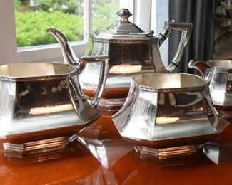 ITEM 25:  Unmarked Four Piece Silver Plate Tea Service  $65
Teapot, at the tallest point is 6.5"