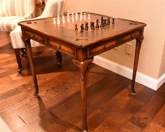 ITEM 42: Theodore Alexander Game Table  $875
Model #5205-018 Very good condition. Leather top embossed with a checkered game board. 32" x 32" square table, 31" tall