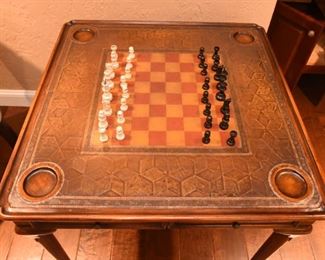 ITEM 42: Theodore Alexander Game Table  $875
Model #5205-018 Very good condition. Leather top embossed with a checkered game board. 32" x 32" square table, 31" tall