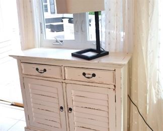 ITEM 64: Cottage Farmhouse Cabinet  $145
White distressed paint. Two drawers and two doors. 44" wide, 12" deep, 36" tall