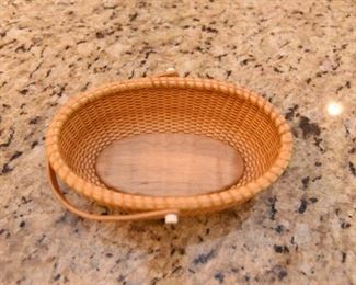 ITEM 77: Small Bill & Janet Sayles Nantucket Basket  $325
Oval basket is 6" long, 4" wide, signed on the bottom, made in 1998. Excellent condition