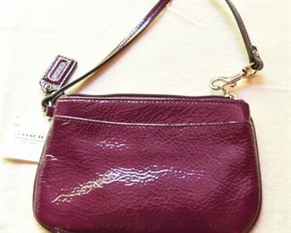 ITEM 96: Coach Patent Grape Wristlet NWT  $20