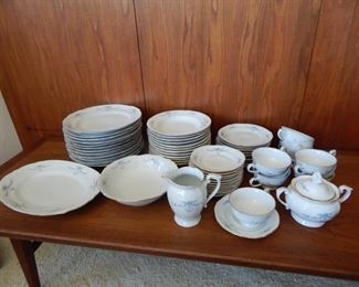 #33 - $75 - China Set (12) Dinner Plates, (12) Bowls, (10) Salad Plates, (1) Jug, (1) Platter, (12) Saucers, (10) Tea Cups, and Sugar Bowl. Made in Poland
