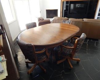#40 - $45 - Oak Pedestal Table with (4) Chairs, (1) Leaf, measures: 72" long by 47 1/2" and 29 1/2" high