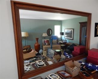 #55 - $20 - A large Wooden Framed Mirror. Measures 66 1/2" wide and 42" Tall