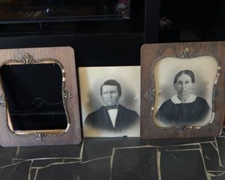 #66 - $10 - Black and White Portraits of a man and a woman in Oak frames 22" by 26"