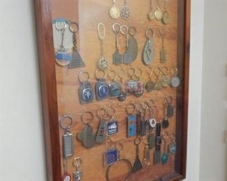#160 - $15 - A framed collection of vintage key chains