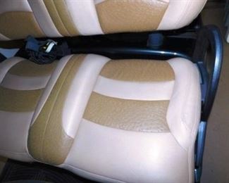 Ostrich-look leather seats with seat belts.
