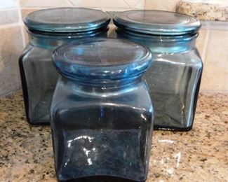 $15.  SET OF 3 LARGE BLUE GLASS CANNISTERS W/LIDS.  Email us or call 512-954-3050 to buy it now or make an offer.