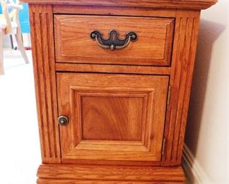 $75.  INTERESTING OAK END TABLE WITH TWO STORAGE AREAS AND A MAGAZINE RACK ON THE BACK.   Email us or call 512-954-3050 to buy it now or make an offer.