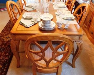 $750.  BEAUTIFUL INLAY FORMAL DINING TABLE WITH 6 CHAIRS AND TWO EXTRA LEAVES.  Email us or call 512-954-3050 to buy it now or make an offer.