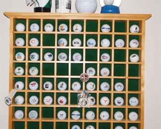$75.  72 SPACE GOLF BALL HOLDER AND COLLEGE LOGO BALLS.  DOES NOT INCLUDE THE ITEMS ON TOP OF THE SHELF.  Email us or call 512-954-3050 to buy it now or make an offer.