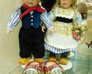 $75.  DANBURY MINT ANNA AND HANS DUTCH 12" PORCELAIN DOLLS AND A PAIR OF WOODEN CLOGS.