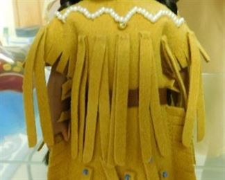 $15.  SMALL PORCELAIN NATIVE AMERICAN INDIAN DOLL.