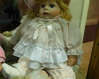 $25.  PORCELAIN DOLL