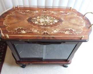 $300.  ITALIAN INLAY TEA CART.  MADE IN ITALY AND BOUGHT IN ITALY.  GLASS DOORS.  SIDES OPEN UP.   