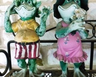 $10.  PAIR OF RESIN FROGS.  SUN-FADED.