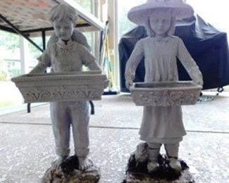 $15.  GIRL AND BOY RESIN PLANTERS.