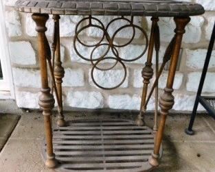 $25.  IRON AND WOOD WINE RACK AND TABLE ON WHEELS.  