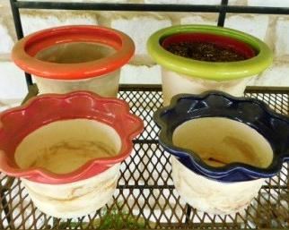 $20.  4 SMALLER PLANTERS.