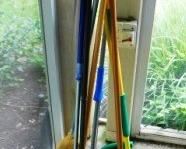 $5 EACH.  PILE OF MOPS, BROOMS ETC...