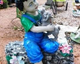 $30.  BOY ON A LOG. 26" TALL X 24" LONG. COMES APART IN TWO PIECES.  KIND OF FADED.  Email us or call 512-954-3050  to buy it now or make an offer.