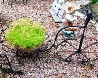 $40,  IRON BIKE PLANTER WITH REAL PLANT AND POT INSIDE OF IT.  35" LONG.  24" TALL.