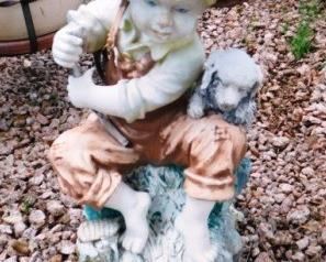 $10.  RESIN GARDEN FISHING BOY STATUE. 19" TALL.