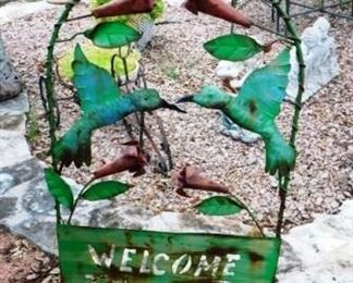 $25.  METAL HUMMINGBIRDS WELCOME TO OUR  GARDEN SIGN.38" TALL.  19" WIDE.