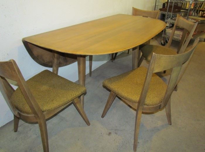 Auction #1 - Heywood Wakefield oval dropleaf (5'2" long, 50" wide) with 4 matching chairs, original seat upholstery.  In excellent condition. All pieces branded with H-W logo.   Minimum opening bid: $100