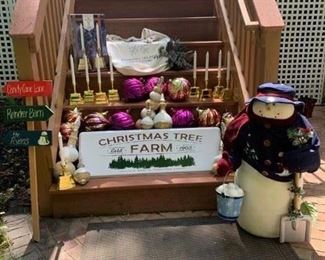 Soft Snowman $30 ; 5 Boxes (10) LED Battery Candles $75 ; Big Glass Ornaments $2 ea. ; Christmas Tree Farm Sign $18 ; Christmas Tree Farm Bag $8 ; Wintertime Sprigs $8 ; Candy Cane Sign $10