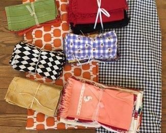 Sets of 4 Napkins $6; Pairs of Napkins $3; Packs of 3 Towels $9; Pack of 20 Napkins Red and Black $28; Pumpkin Plastic Cloth w Felt backing $8; Blue Gingham Cloth $14
