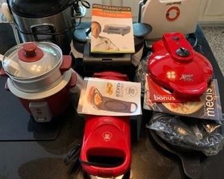 Spring Switzerland 5 Cup Rice Cooker $25; Lorena Bella Mini Rice Cooker $8; Yes Chef Smelter Maker $6; Wolfgang Puck Pie & Pastry Baker $20; Magic Chef Sandwich Maker $10; Xpress RediSetGo Cooker $14