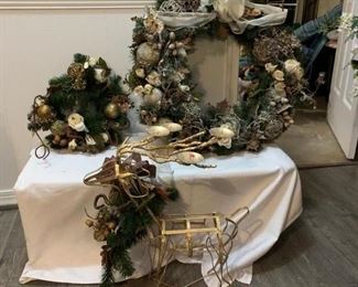 Large Winterland Frosted Wreath $28 ; Gilded Reindeer Votive Holder $22 ; Small Winter Wonderland Wreath $10