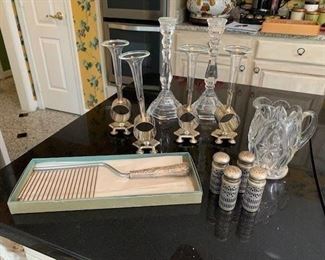 Pair of Glass Candle Sticks $10; Cut Glass Pitcher $10; 2 Sets S/P and Cobalt Glass Shakers $10; Sterling Weighted Handle Angel Food Cake Slicer $14; S/P Set of 11 Napkin Rings with Posy Holders $10