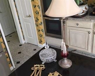 Etched and Cut Glass Covered Bowl $22; Single Silver Painted Candlestick Lamp $10; Pair Brass Decorative Bowls $18; London Coat of Arms Brass Travel $20
