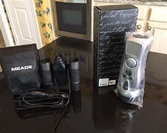 Meade Binoculars, allows you to photo what you see! Together w Hand Charging Radio, boxed. $28
