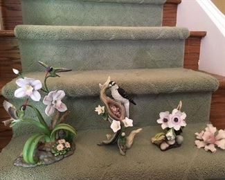 Maruri Studios Hummingbirds and Orchids $48; Boehm woodpecker and babies $58; signed Boehm anemone $48; German porcelain orchid $38
