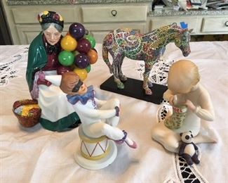 Royal Doulton Balloon Seller $65; Kaiser child clown $40; Painted pony $24; Cybis child Christmas morning $35