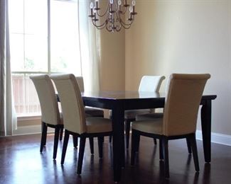 Dining table with leaf and 6 upholstered armless matching chairs (53.75w x 78.25l with leaf x 3.75h); leaf is 24"