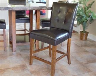 Kitchen table (47.75 sq x 35.85h) with 4 faux leather armless chairs; made in China
