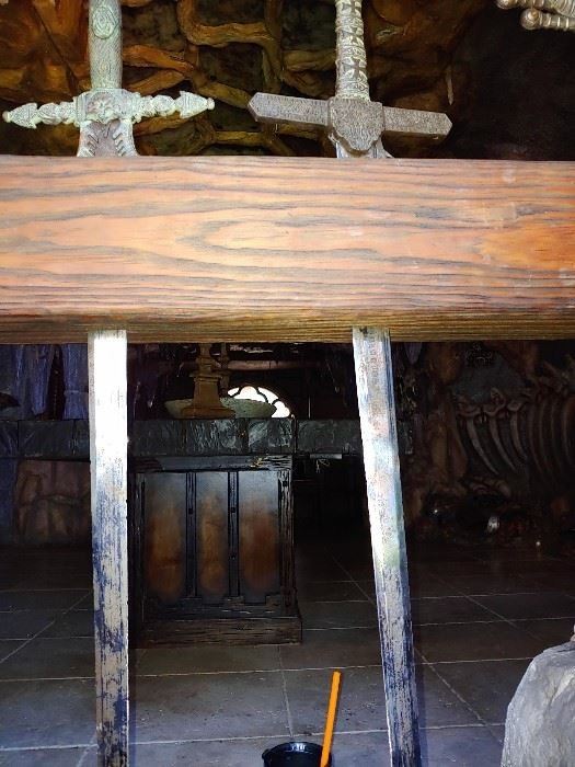 Set of swords set in wood as a staircase rail.  