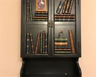 Library themed decorative wall cabinet. Opens with 2 shelves inside. 18 x 27 x 6.5 $20