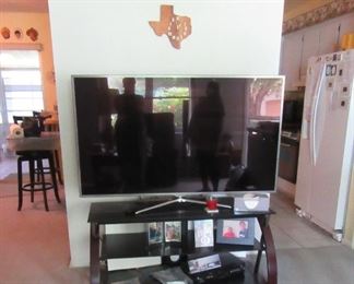 longhorn steer horns, big screen tv and stand
