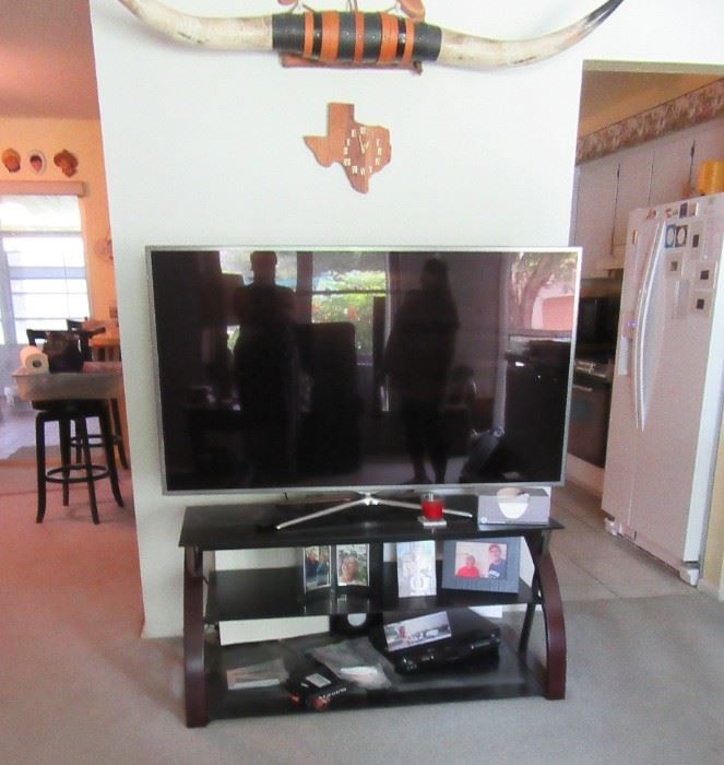longhorn steer horns, big screen tv and stand