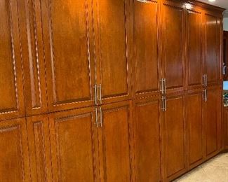 Wall to wall wood  kitchen cabinets.