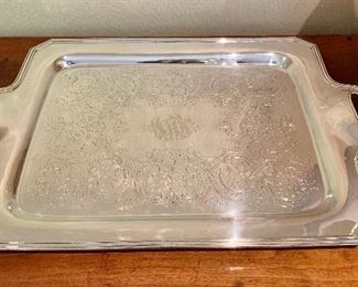 $150  Intricately engraved silver-plated handled serving tray.  Approx 28" X18"